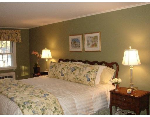 88 Hampshire Road Wellesley, MA 02481 - Photo 19 of 28 a bedroom with a bed and a lamp