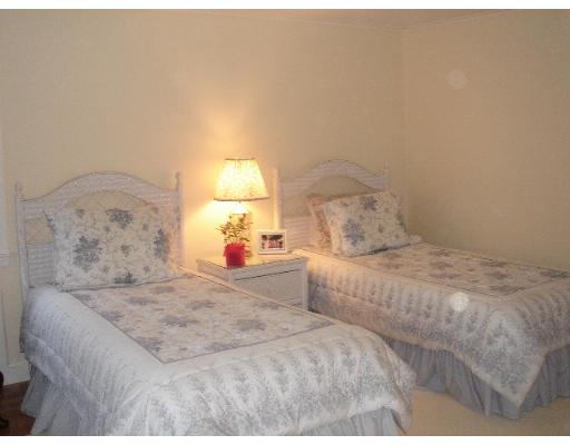 88 Hampshire Road Wellesley, MA 02481 - Photo 23 of 28 a bedroom with a bed and a night stand