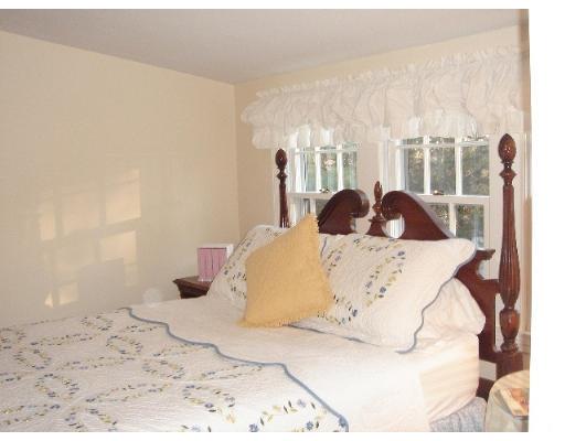 88 Hampshire Road Wellesley, MA 02481 - Photo 26 of 28 a large bed sitting in a bedroom next to a window