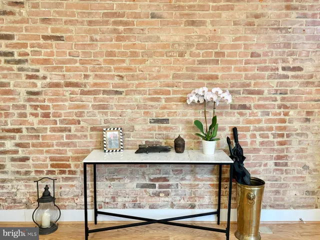 a view of a living room with a fireplace