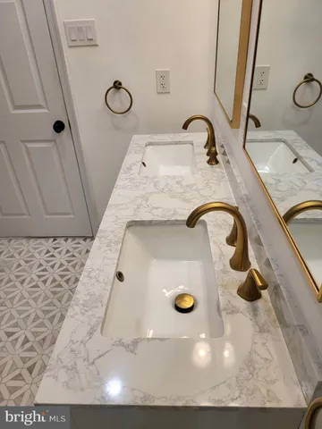 a balcony with table and chairs