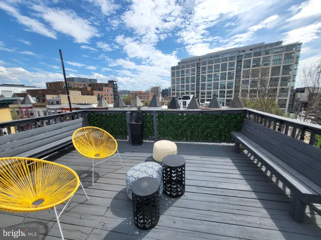 a view of a balcony with chairs
