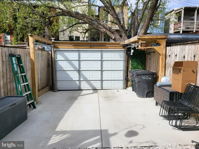 a view of wooden deck and a forest