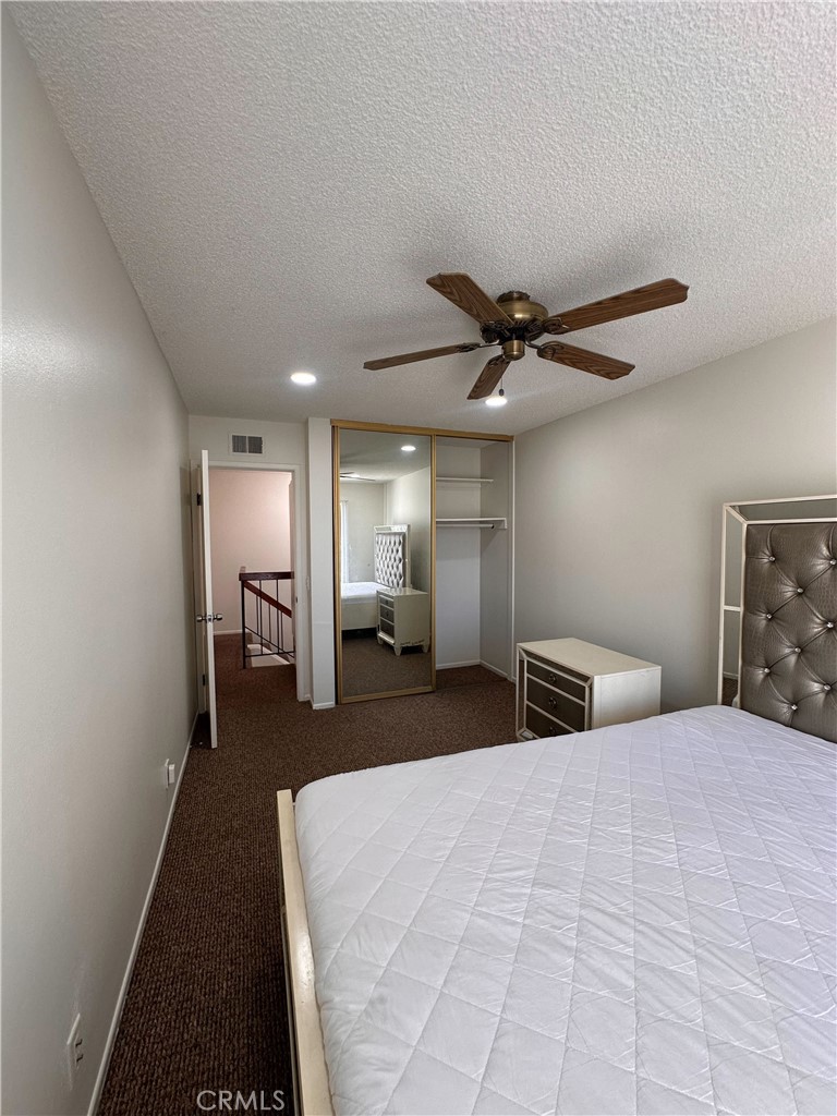 957 South Landmark Lane Anaheim, CA 92805 - Photo 23 of 24 a bedroom with a bed and a ceiling fan