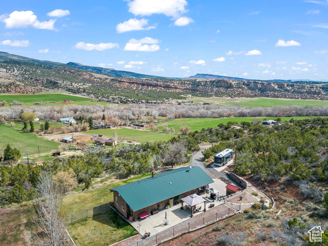 6407 North Dry Frk Cyn Road West Vernal, UT 84078 - Photo 47 of 48 Aerial view of property and surrounding area with mountains