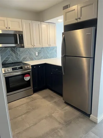a view of an empty room with a balcony