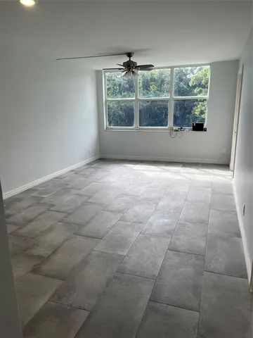 an empty room with a mirror