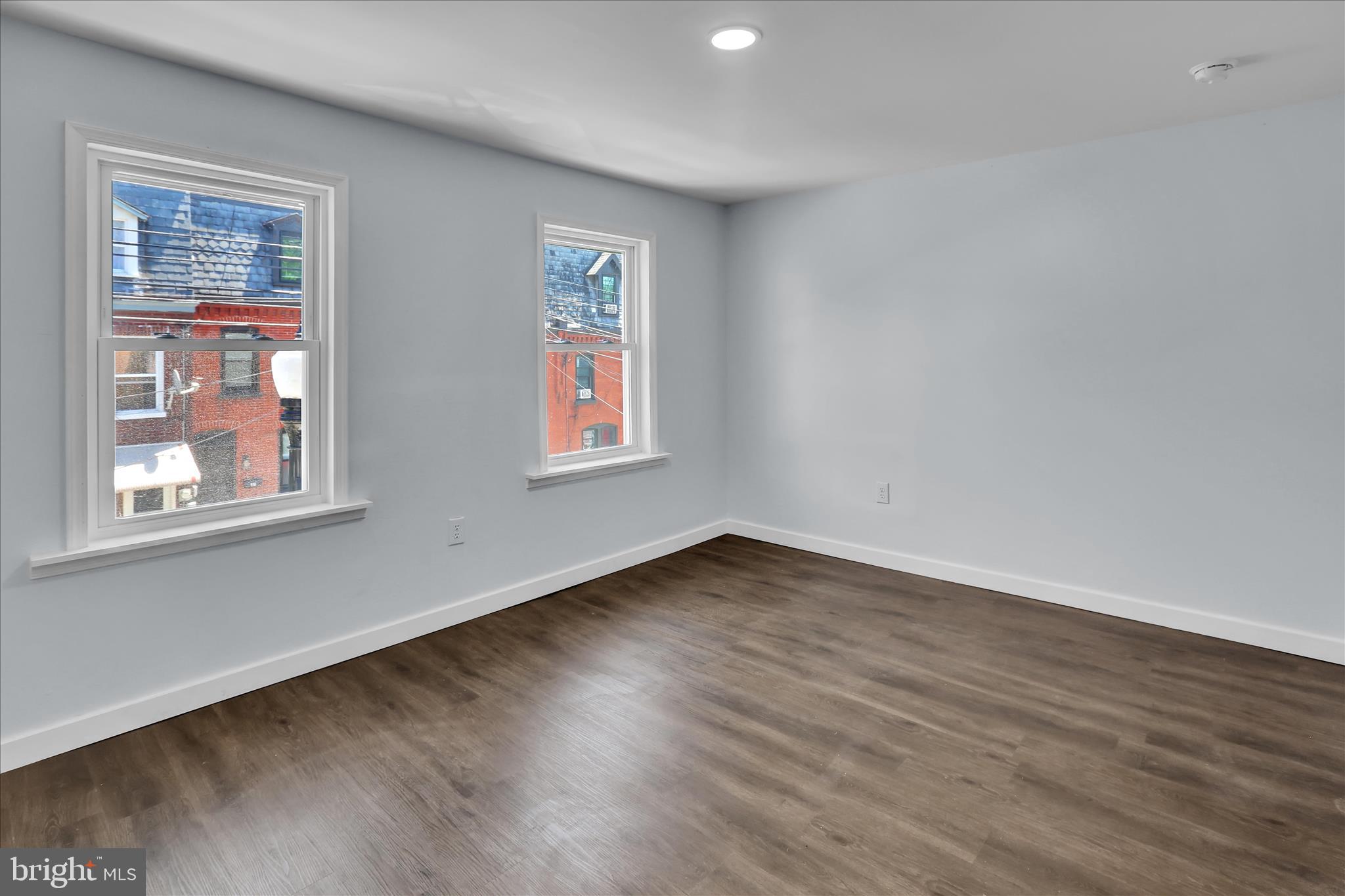 513 Manor Street Lancaster, PA 17603 - Photo 30 of 37 a view of an empty room with wooden floor and a window