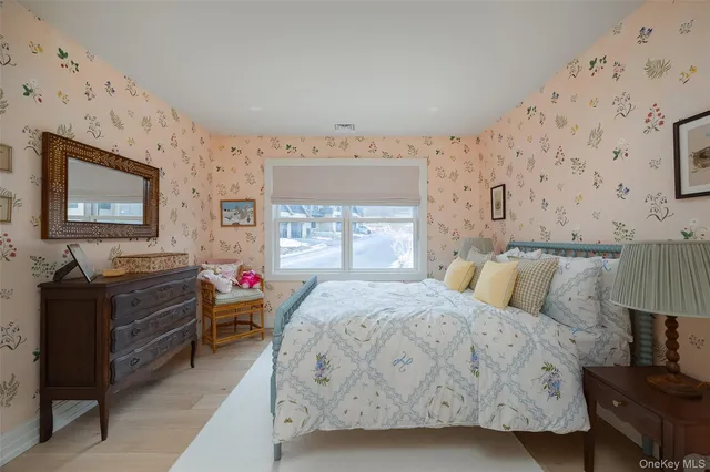 a bedroom with bed and window