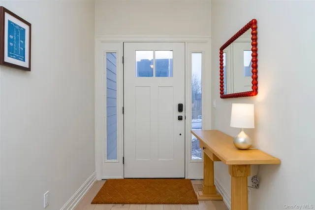 a bathroom with a toilet and a mirror