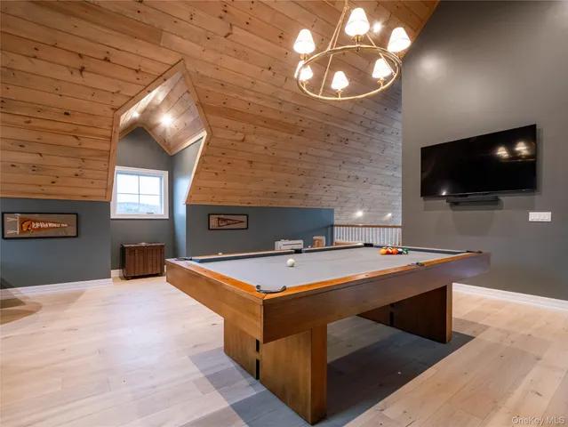 a room with furniture and flat screen tv