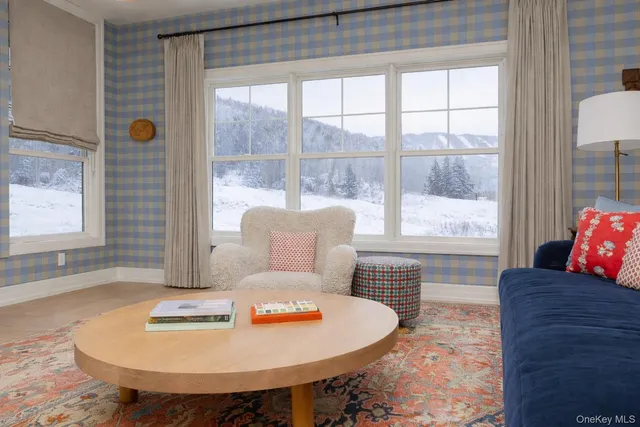 a living room with furniture and a table