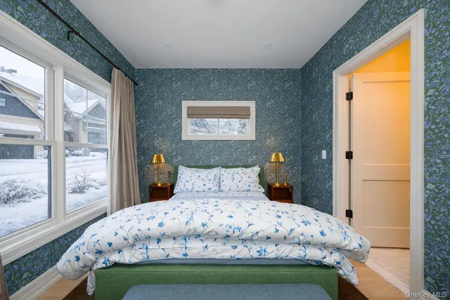 a bedroom with a bed and window