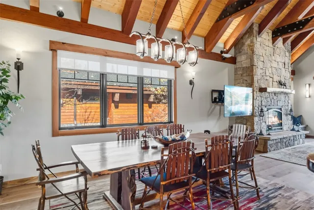 a view of a a dining room with furniture window and outside view