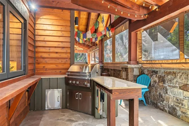 a utility room with a sink and cabinets
