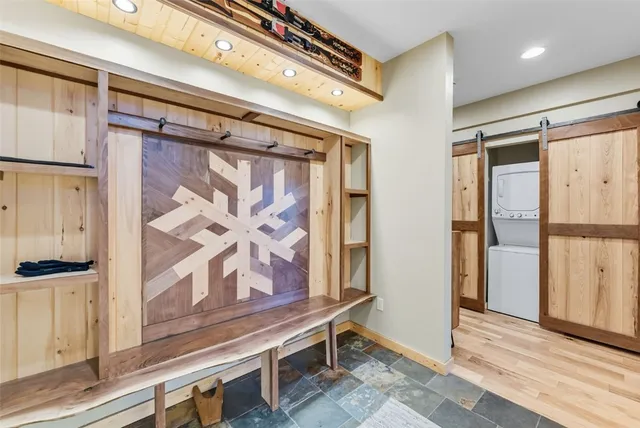 a view of an entryway with wooden floor