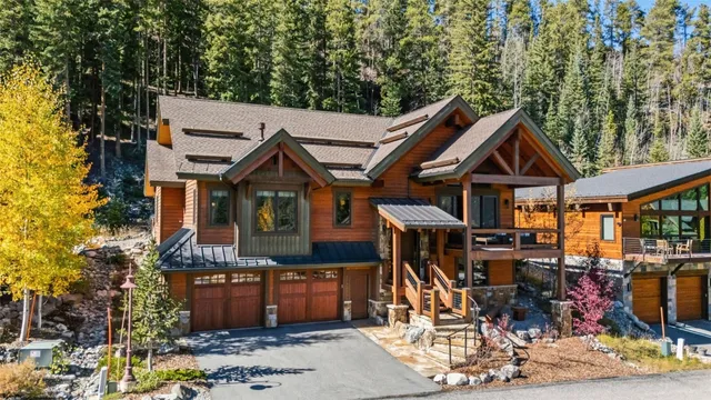 a view of a house with wooden deck