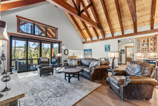 a living room with furniture or couch and a large window