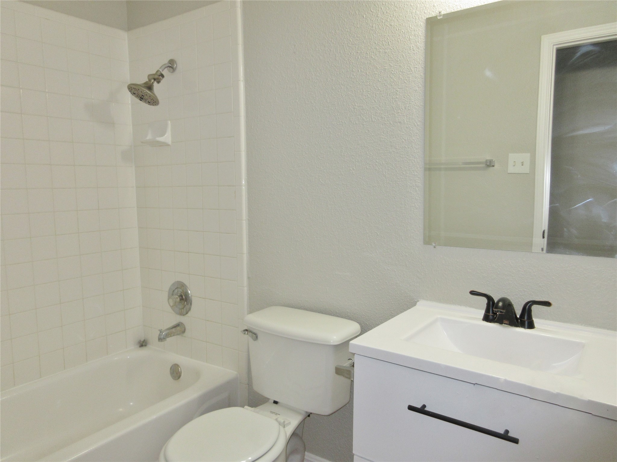 115 Rei Tang Loop Kyle, TX 78640 - Photo 13 of 17 a bathroom with a sink toilet and shower