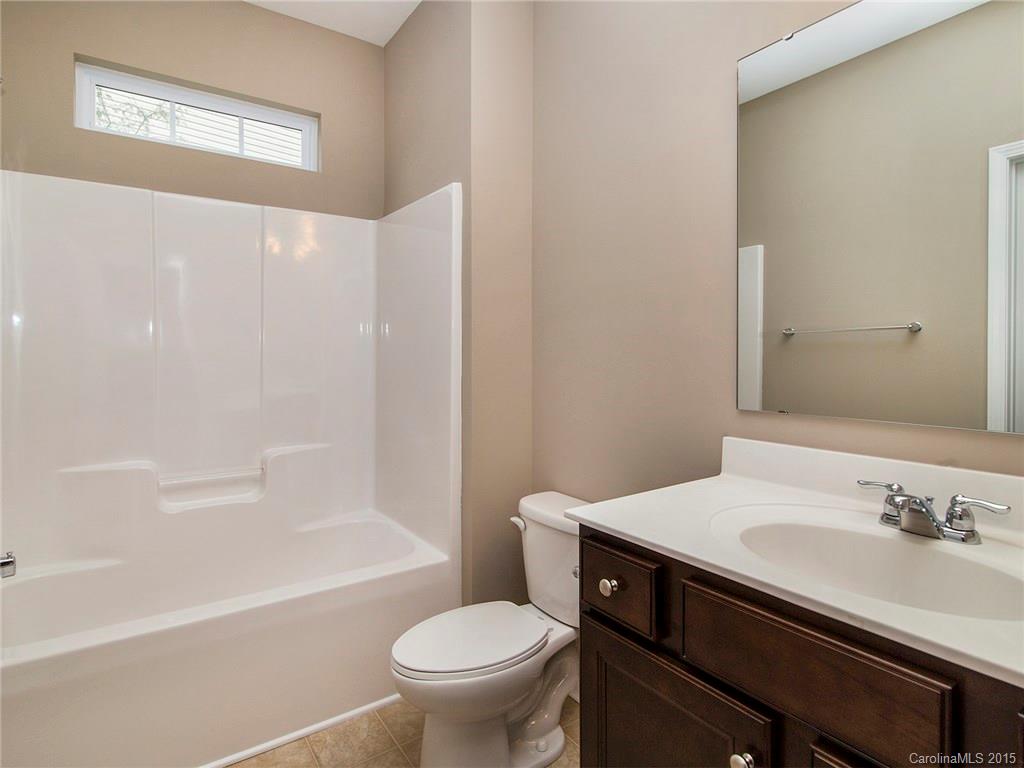 79235 Ridgehaven Road, Unit 4 Lancaster, SC 29720 - Photo 14 of 24 a bathroom with a sink a toilet and a bathtub