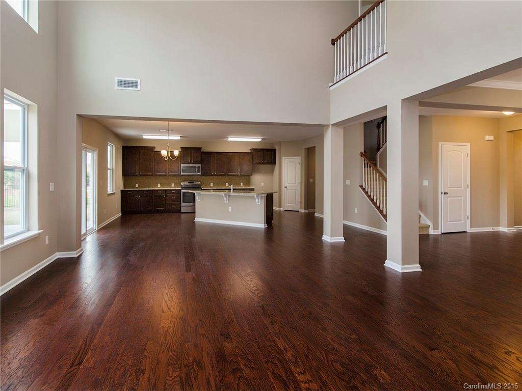 79235 Ridgehaven Road, Unit 4 Lancaster, SC 29720 - Photo 3 of 24 a view of a hallway with wooden floor kitchen view and a window