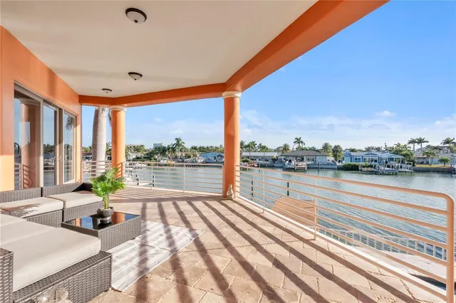 a bathroom with a granite countertop toilet sink and mirror