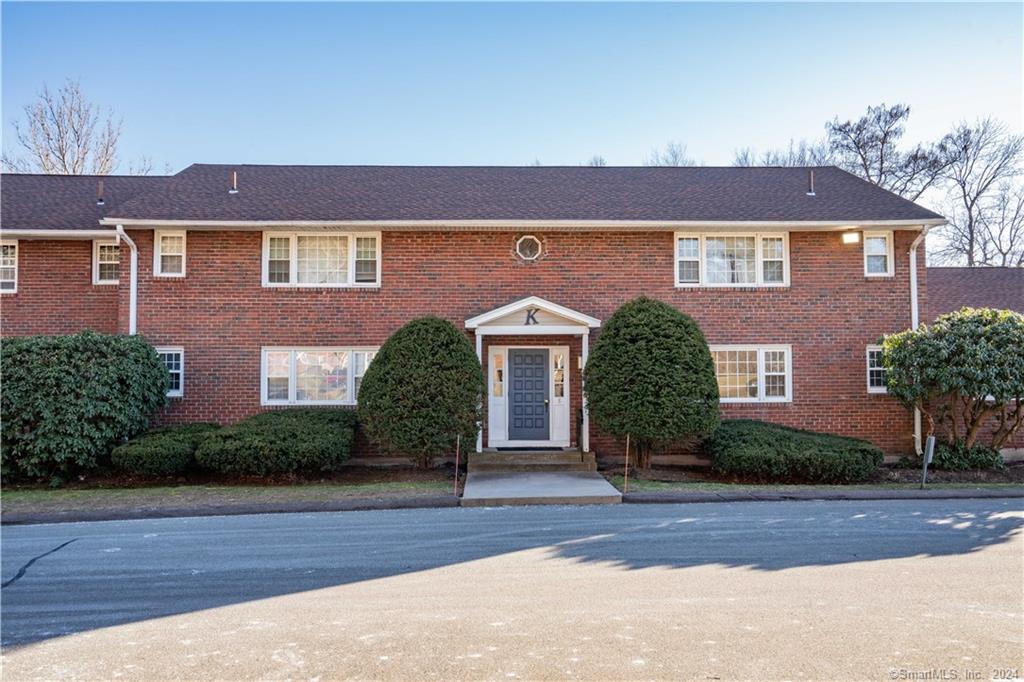 4 Loveland Hill Road, Unit K4 Vernon, CT 06066 - Photo 1 of 1 a front view of a house with a yard