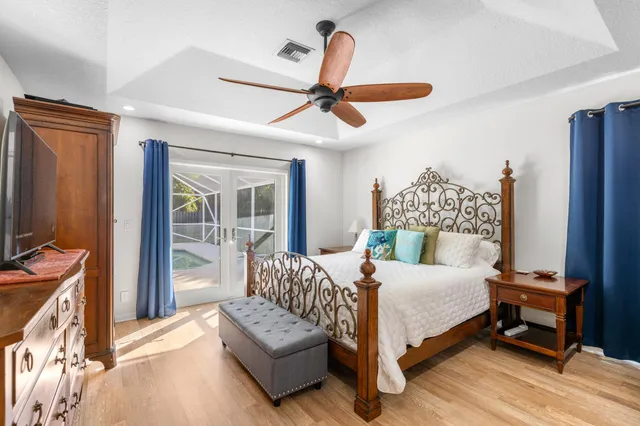 a bedroom with a bed couch and a window