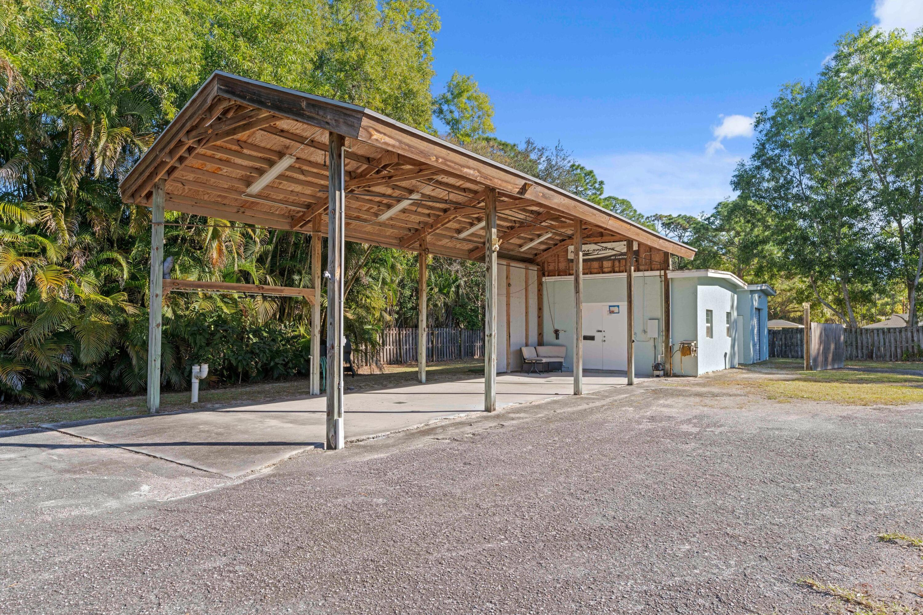 17392 Mellen Lane Jupiter, FL 33478 - Photo 21 of 38 a view of a house with backyard and a tree