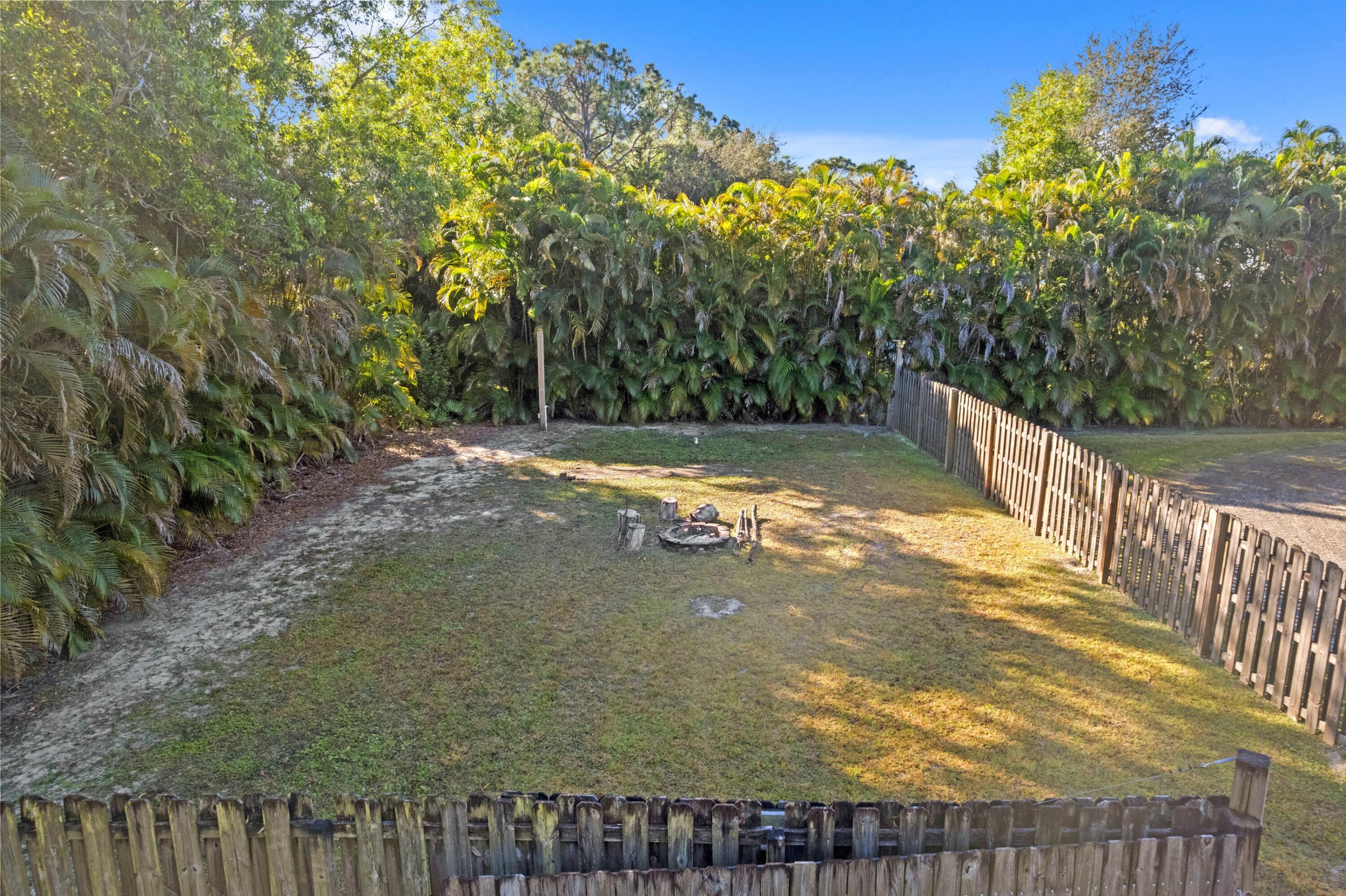17392 Mellen Lane Jupiter, FL 33478 - Photo 22 of 38 a view of a back yard of the house