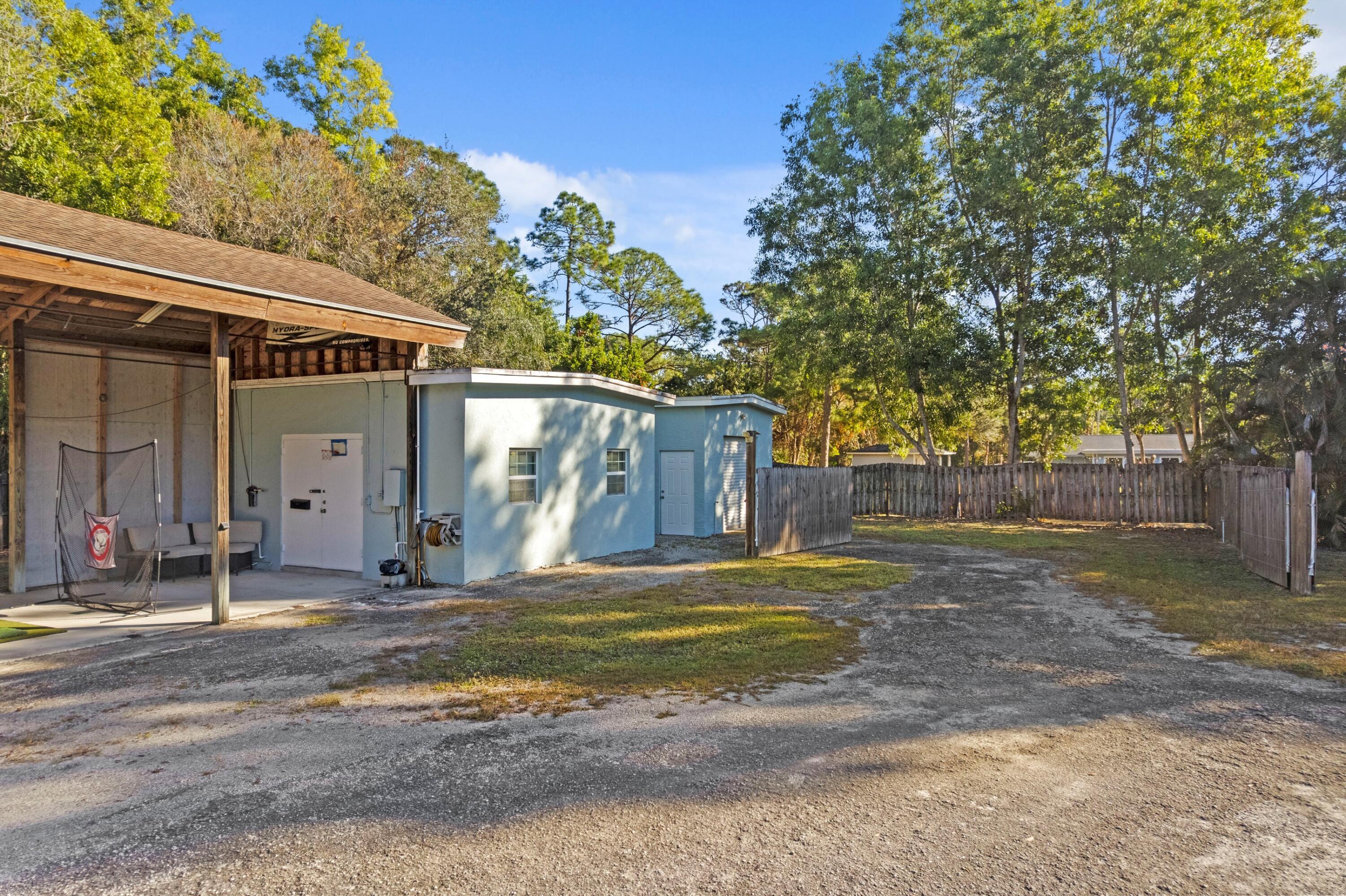 17392 Mellen Lane Jupiter, FL 33478 - Photo 25 of 38 a view of a house with a outdoor space