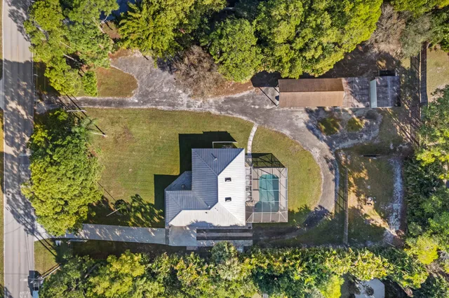 an aerial view of a house with a garden
