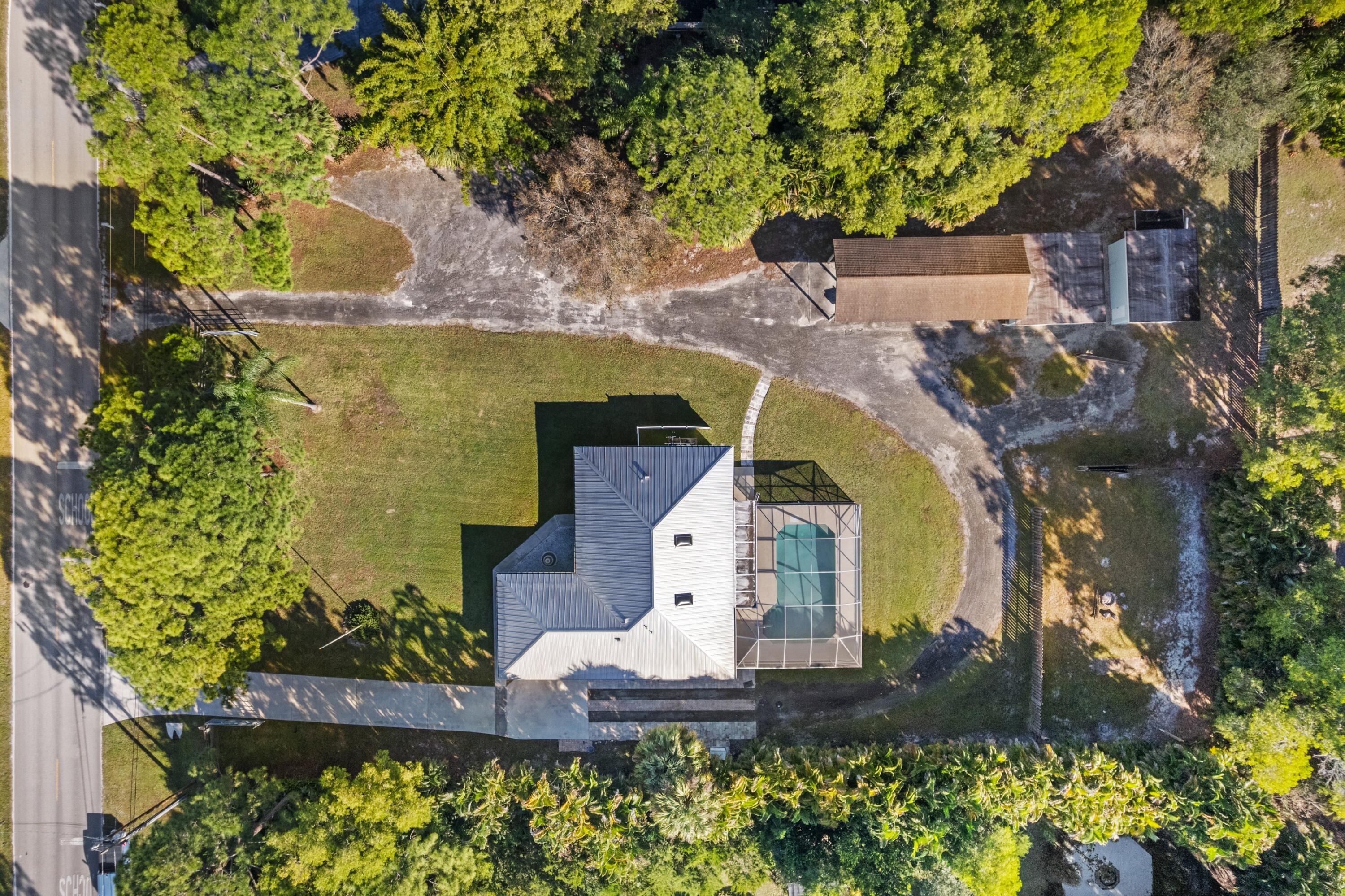 17392 Mellen Lane Jupiter, FL 33478 - Photo 33 of 38 an aerial view of a house with a garden