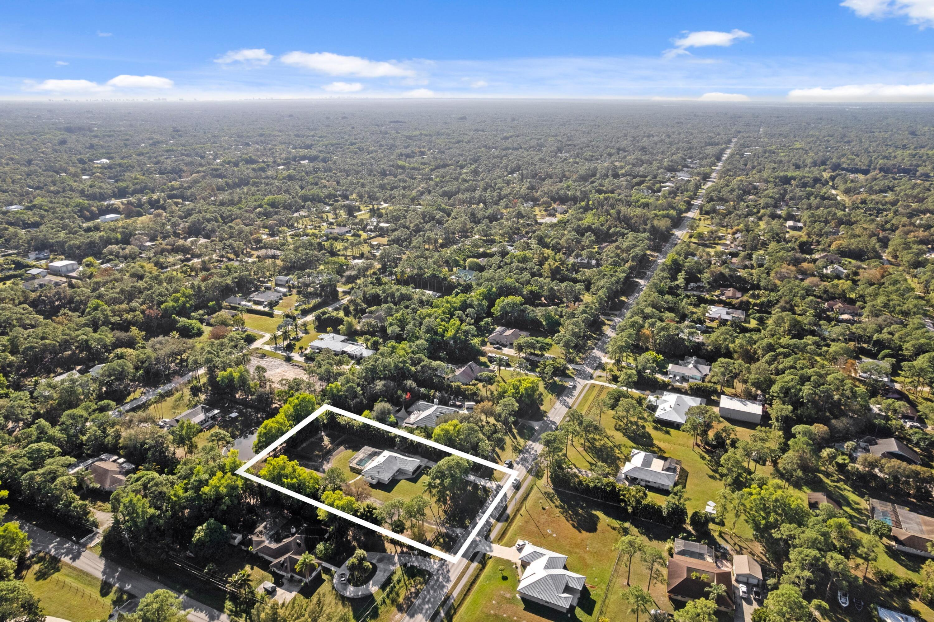 17392 Mellen Lane Jupiter, FL 33478 - Photo 36 of 38 an aerial view of a city