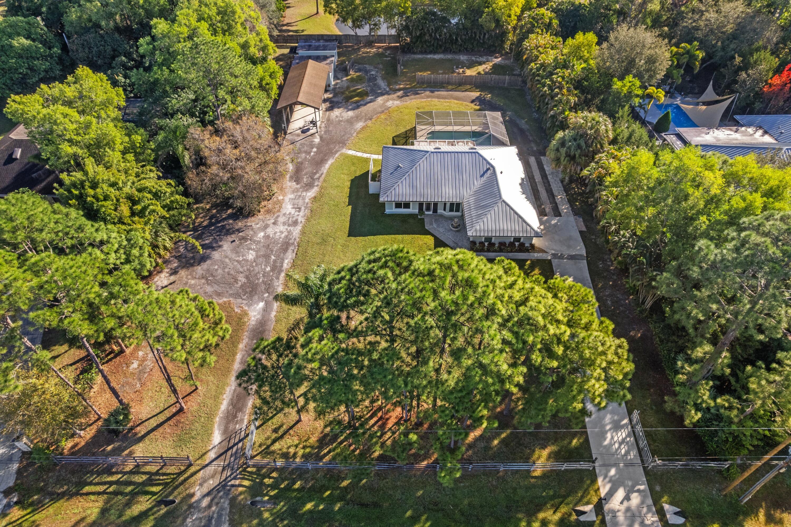 17392 Mellen Lane Jupiter, FL 33478 - Photo 37 of 38 a view of a house with a swimming pool