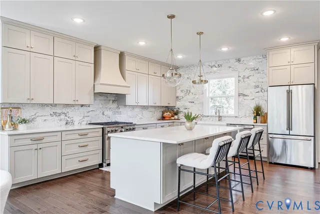 a spacious bedroom with a bed a couch and a window