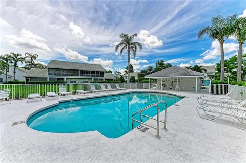a view of a swimming pool with a lounge chairs