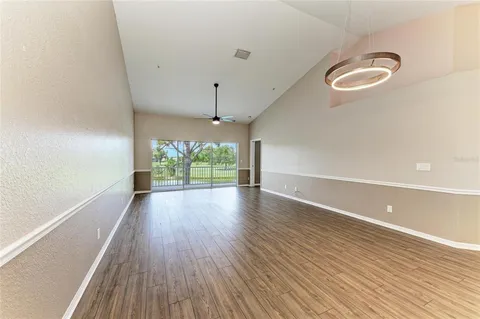 a view of kitchen with cabinets and wooden floor