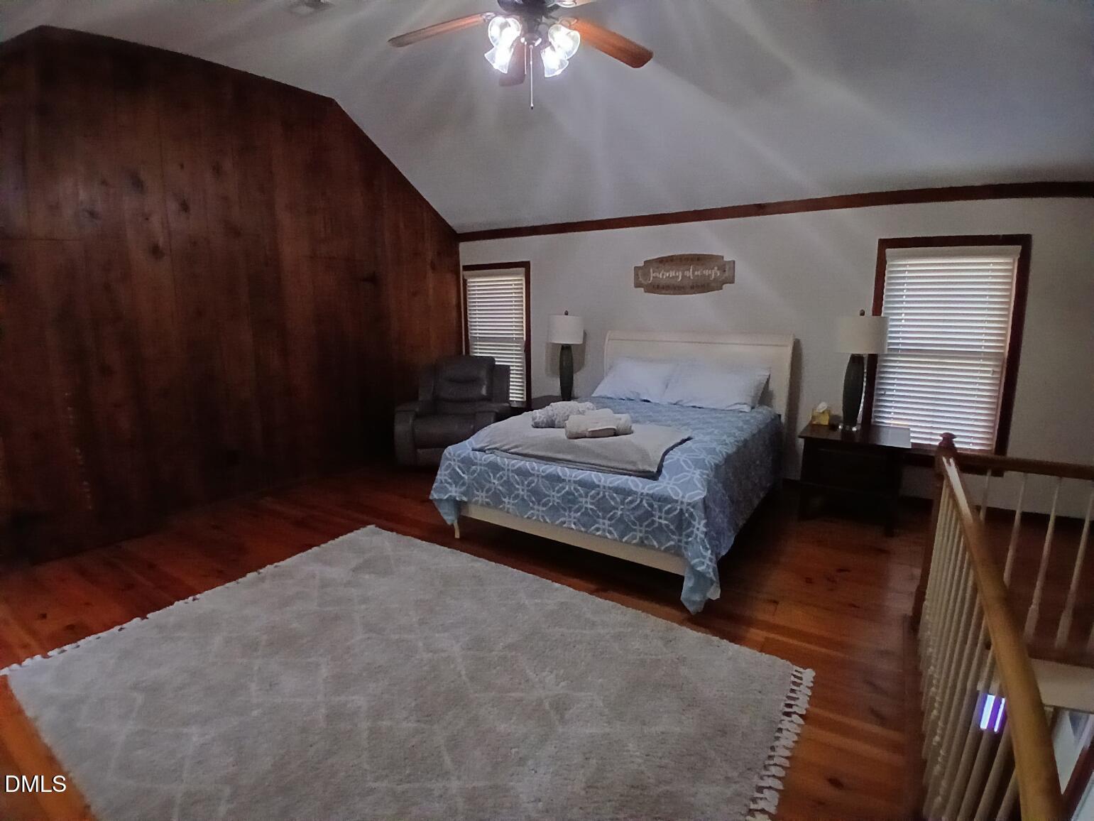 1920 Kelly Road Apex, NC 27502 - Photo 33 of 44 a bedroom with a bed and wooden floor