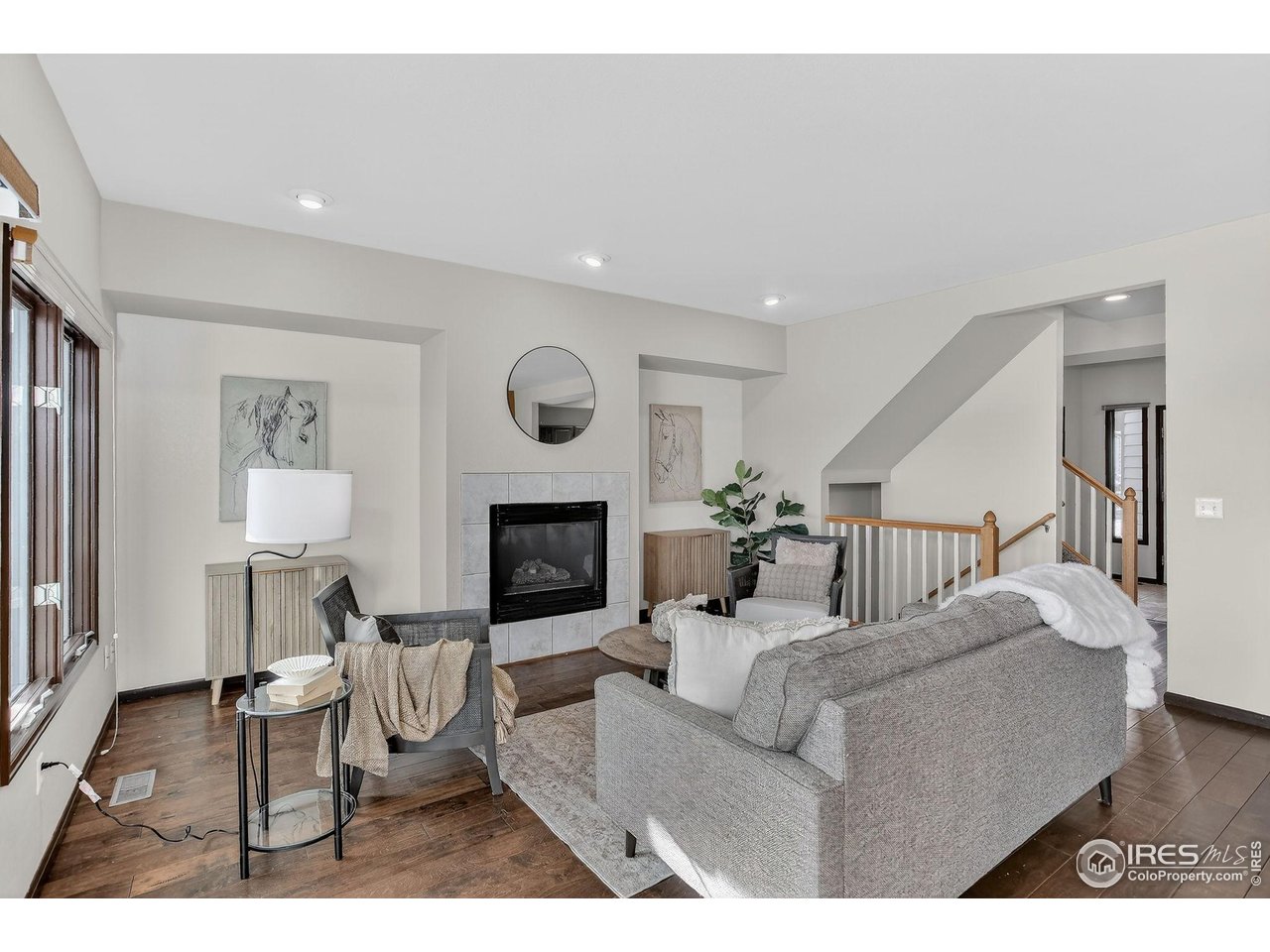 3658 Point Drive Fort Collins, CO 80524 - Photo 11 of 50 a living room with furniture and a fireplace
