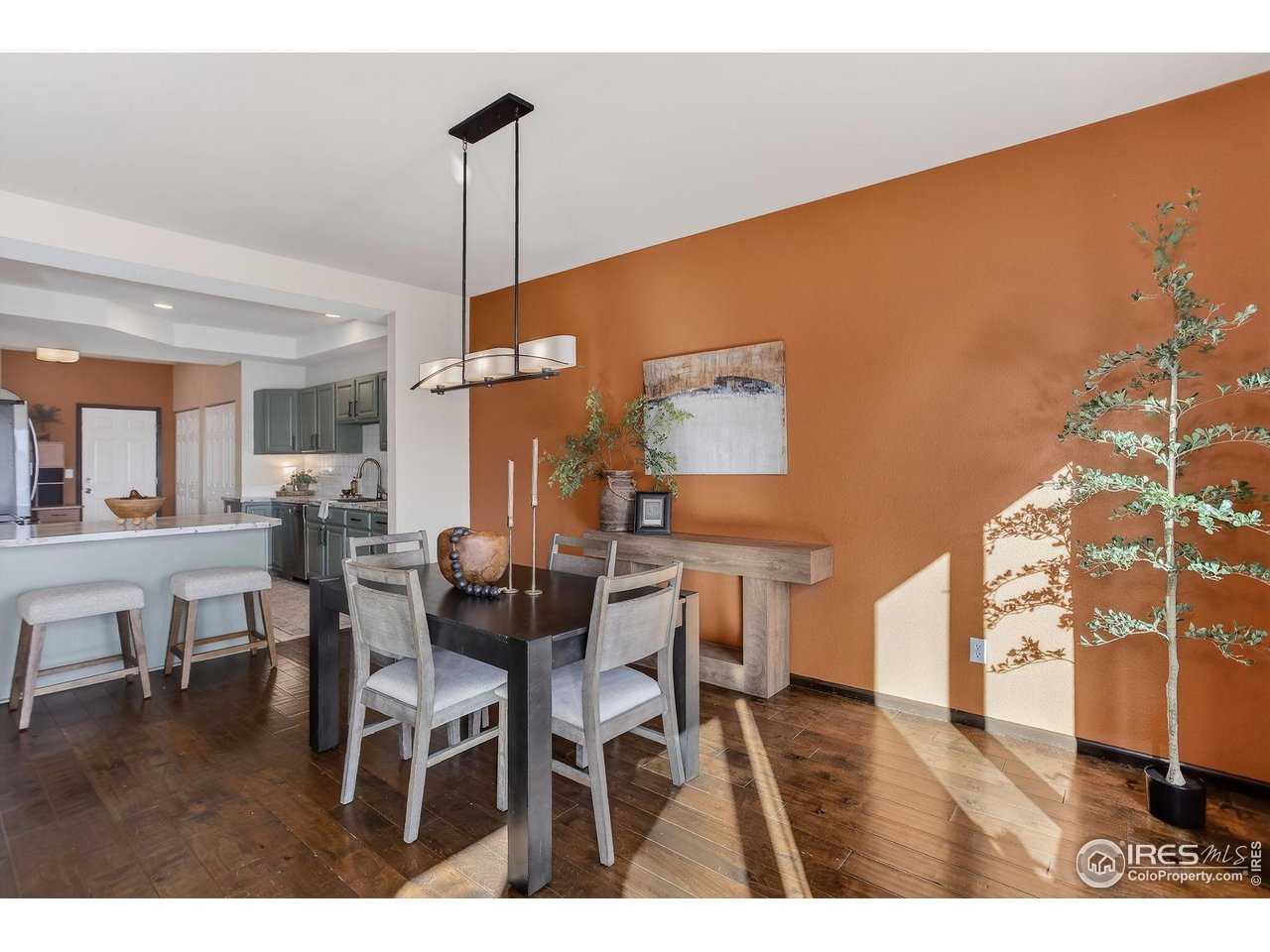3658 Point Drive Fort Collins, CO 80524 - Photo 17 of 50 a dining room with furniture and wooden floor