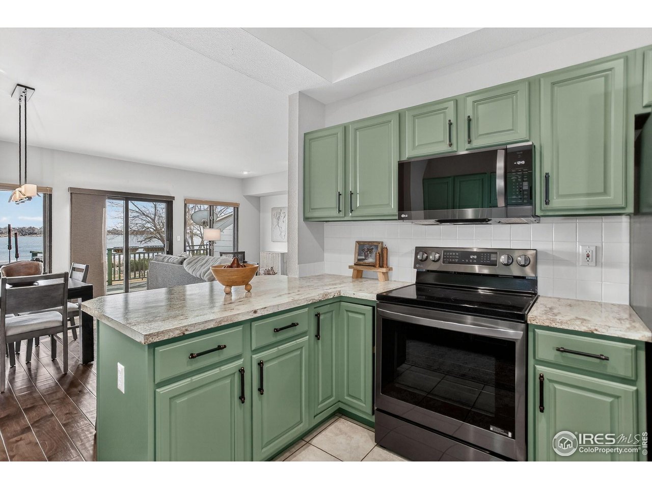 3658 Point Drive Fort Collins, CO 80524 - Photo 21 of 50 a kitchen with a sink stove and microwave