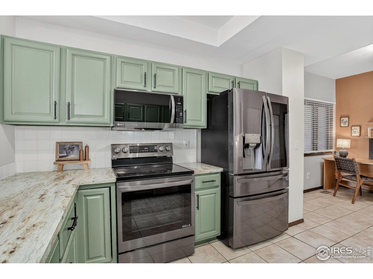 3658 Point Drive Fort Collins, CO 80524 - Photo 22 of 50 a kitchen with a refrigerator stove and microwave