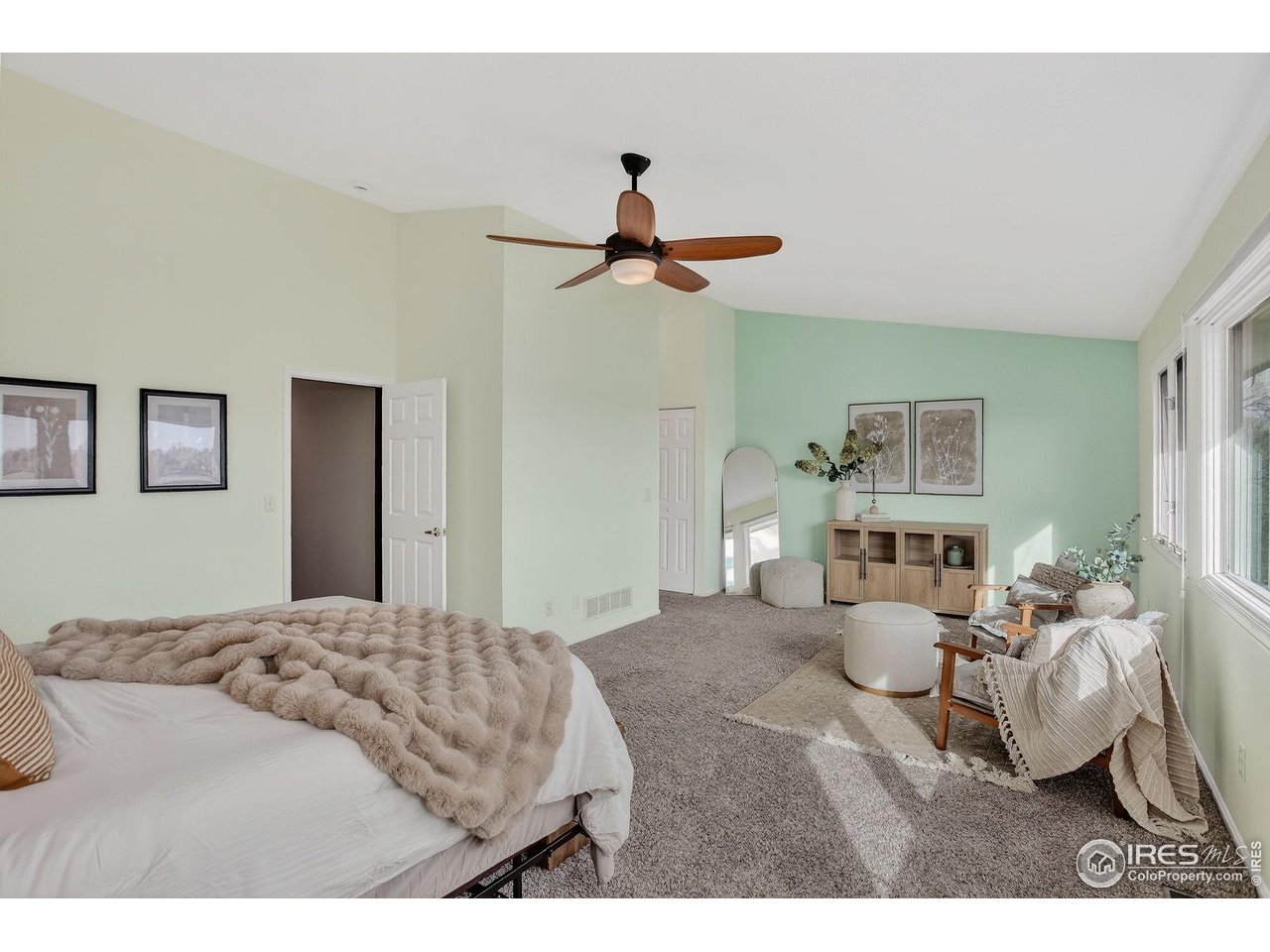 3658 Point Drive Fort Collins, CO 80524 - Photo 28 of 50 a bedroom with a bed and a chandelier