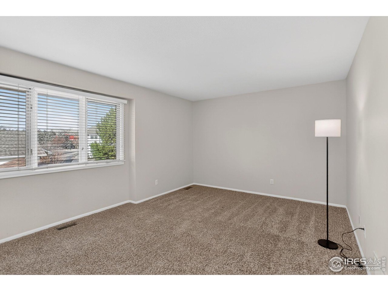 3658 Point Drive Fort Collins, CO 80524 - Photo 33 of 50 a view of an empty room with a window