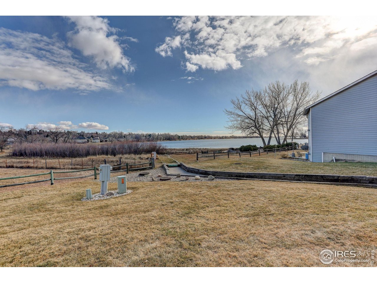 3658 Point Drive Fort Collins, CO 80524 - Photo 5 of 50 a view of a lake with houses in the back