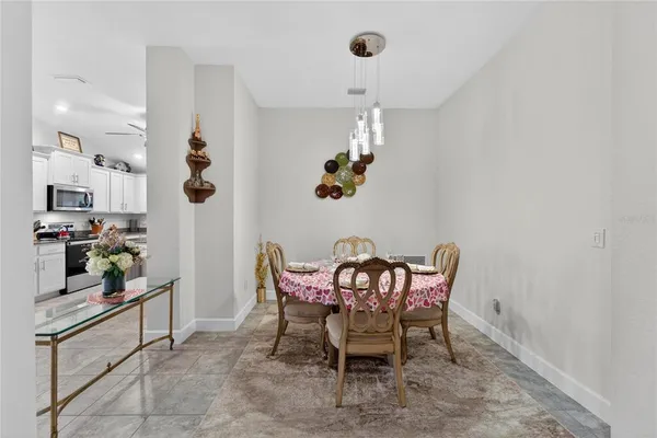 a kitchen with stainless steel appliances granite countertop a sink a stove a microwave and cabinets