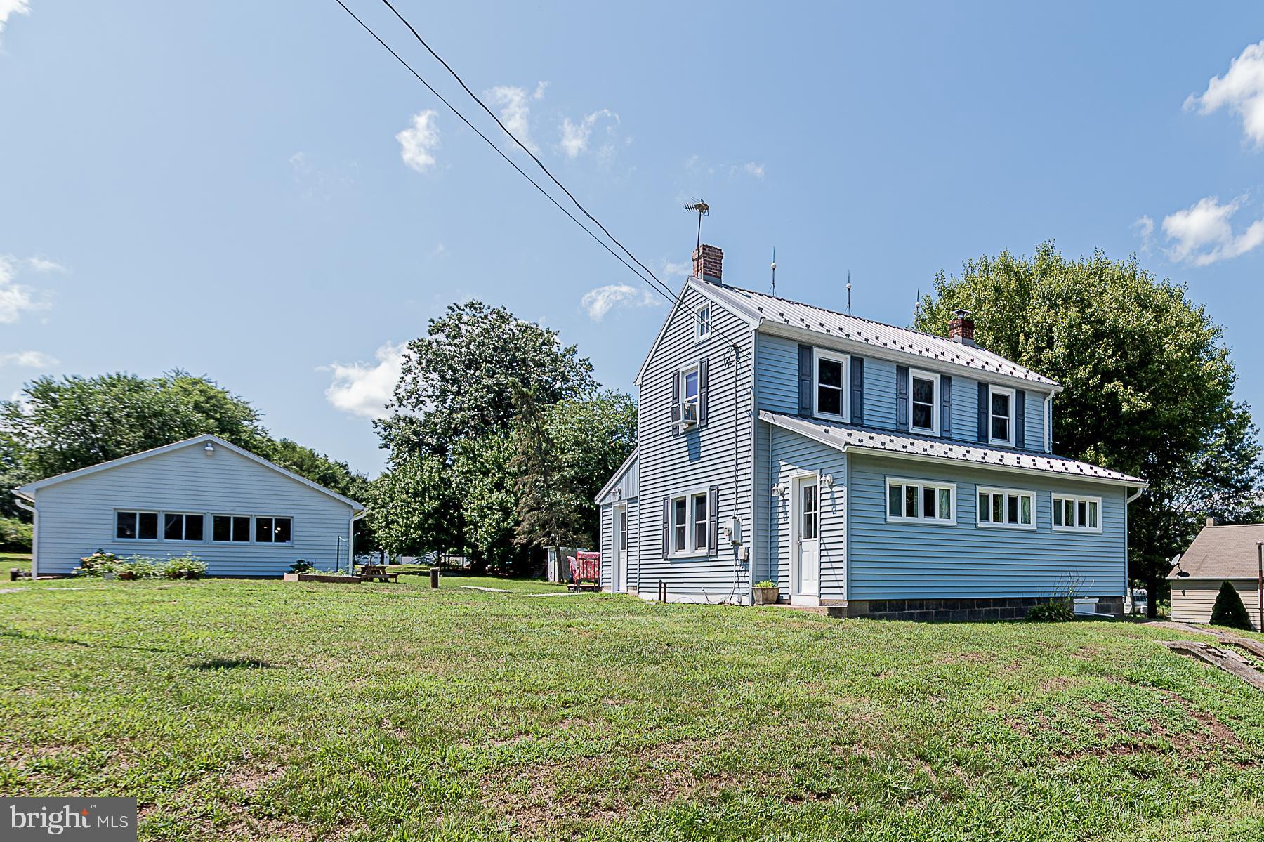 77 Love Run Road Colora, MD 21917 - Photo 1 of 43 a front view of a house with a garden