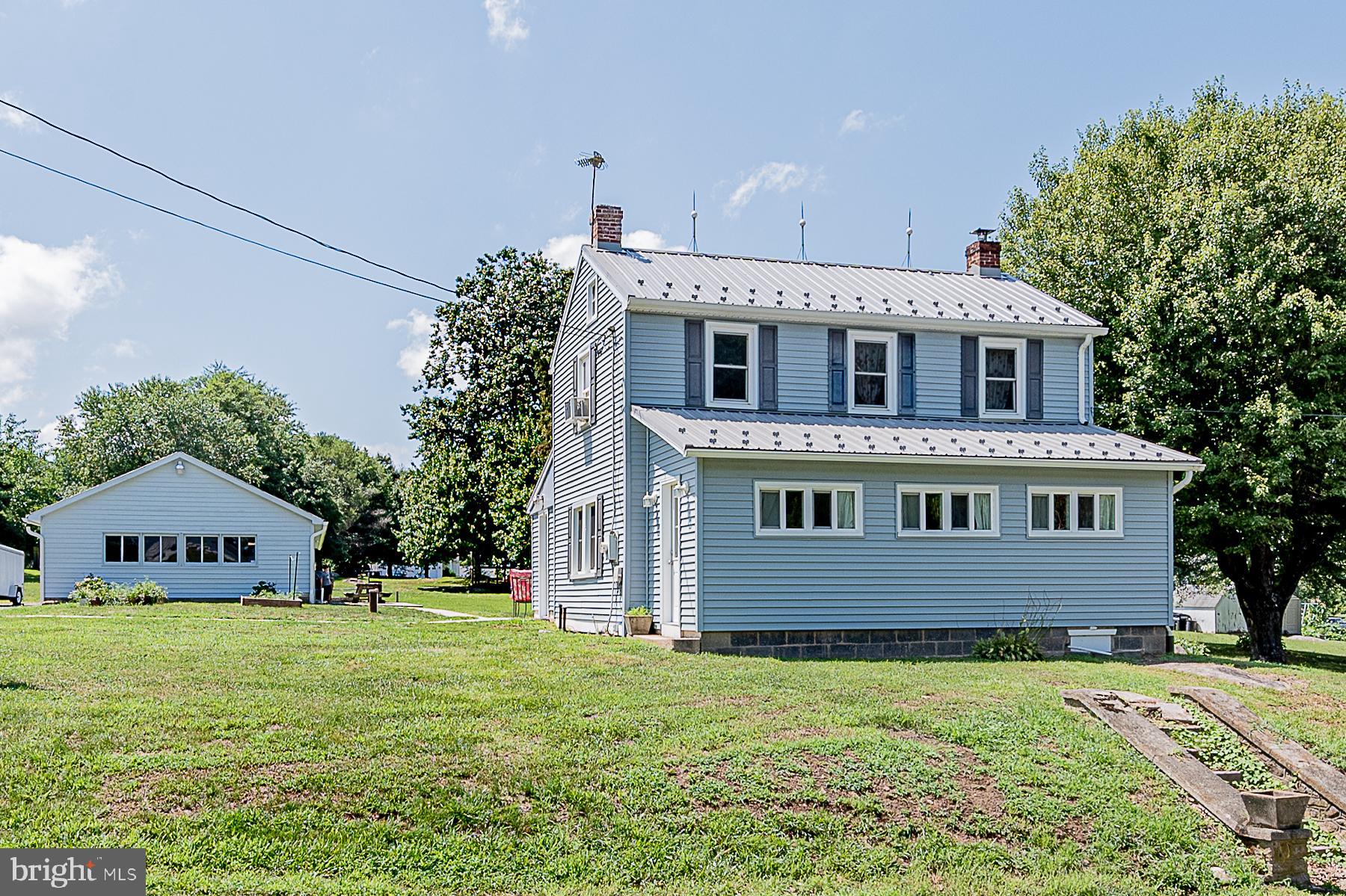 77 Love Run Road Colora, MD 21917 - Photo 2 of 43 a front view of a house with garden