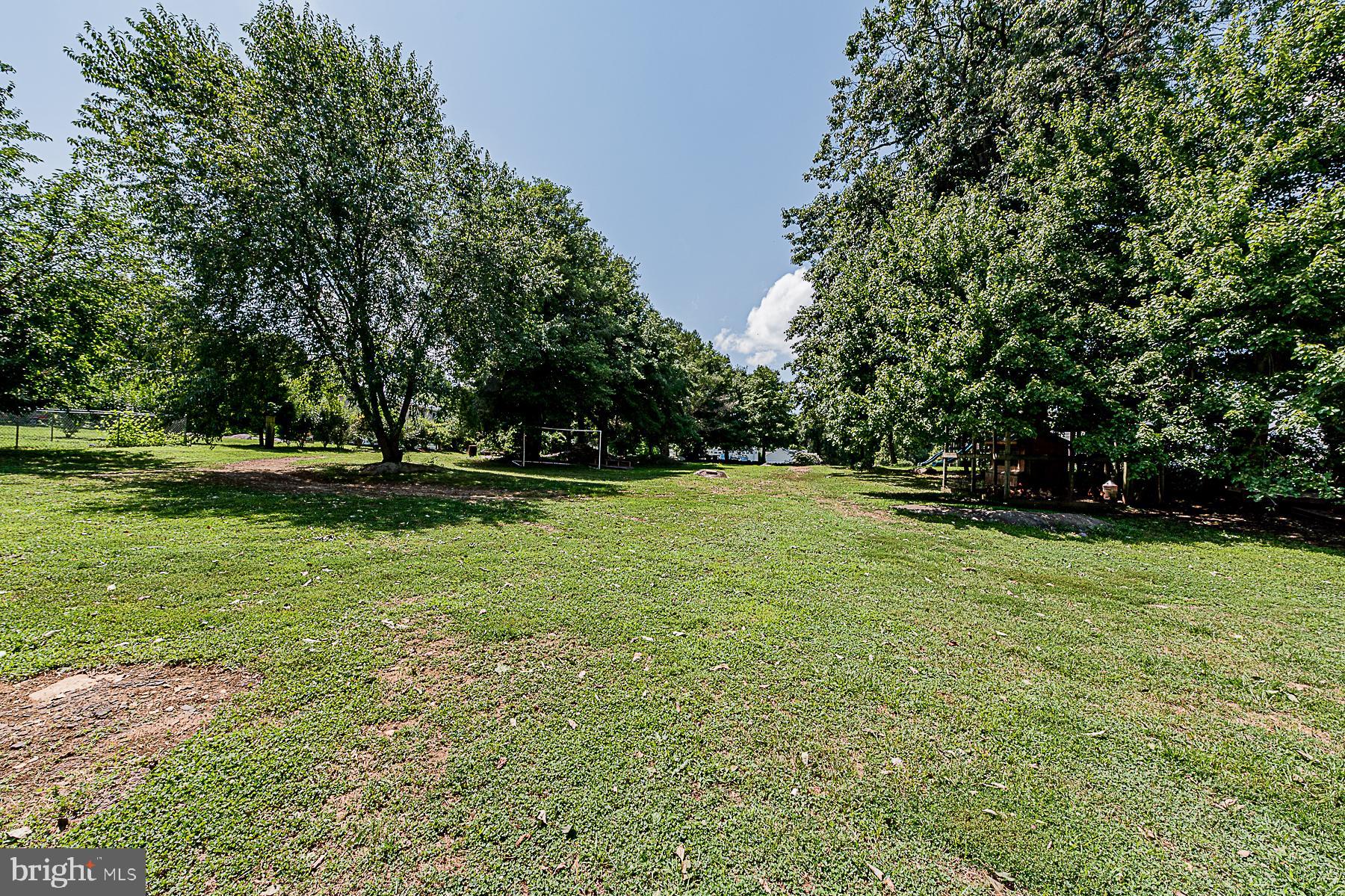 77 Love Run Road Colora, MD 21917 - Photo 11 of 43 a view of outdoor space with deck and yard